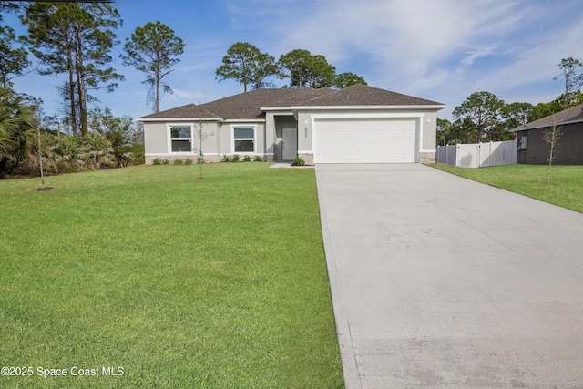 878 Reading St SE Unit 22, Palm Bay, FL 32909 - view of front of home featuring a garage, driveway, stucco siding, and stone siding