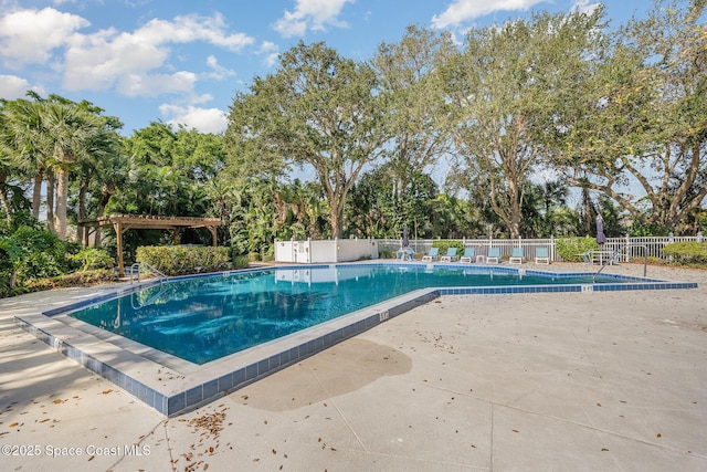 714 Players Ct, Melbourne, FL 32940 - community pool featuring a patio and view of scattered trees