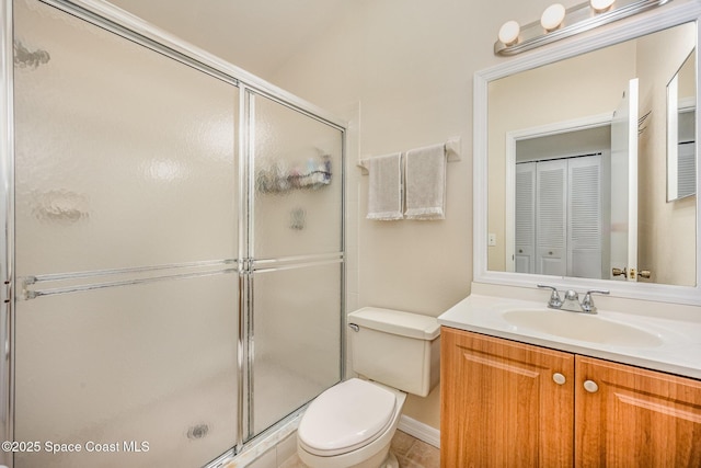 714 Players Ct, Melbourne, FL 32940 - bathroom with toilet, a stall shower, and vanity