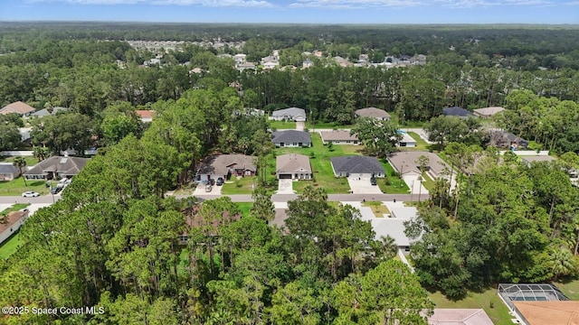 15 Ponderosa Ln, Palm Coast, FL 32164 - aerial view of property's location featuring nearby suburban area and a heavily wooded area