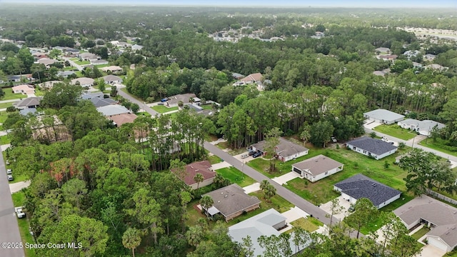 15 Ponderosa Ln, Palm Coast, FL 32164 - aerial view of property and surrounding area featuring nearby suburban area and a heavily wooded area