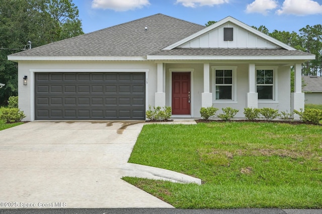 15 Ponderosa Ln, Palm Coast, FL 32164 - view of front of house featuring a shingled roof, concrete driveway, board and batten siding, an attached garage, and a front yard