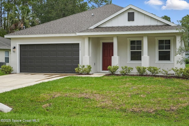 15 Ponderosa Ln, Palm Coast, FL 32164 - view of front of property with roof with shingles, board and batten siding, a garage, driveway, and a front lawn