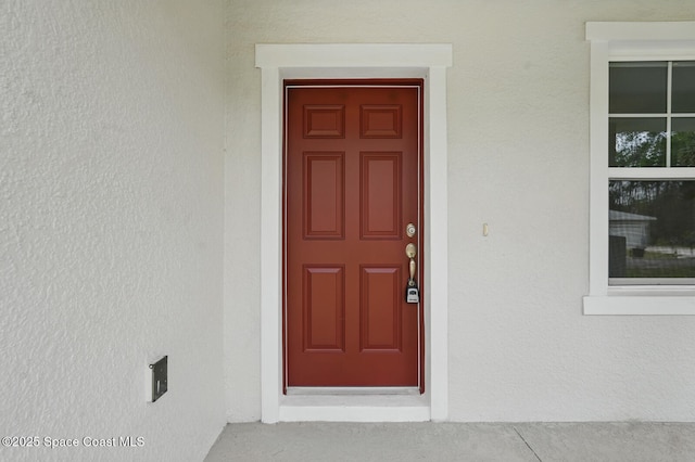 15 Ponderosa Ln, Palm Coast, FL 32164 - view of exterior entry featuring stucco siding