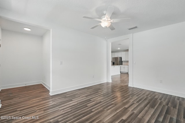 15 Ponderosa Ln, Palm Coast, FL 32164 - spare room with dark wood-style flooring, ceiling fan, baseboards, and recessed lighting