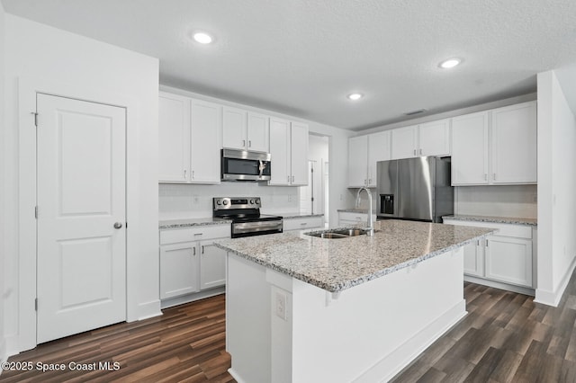 15 Ponderosa Ln, Palm Coast, FL 32164 - kitchen featuring appliances with stainless steel finishes, a sink, dark wood-type flooring, backsplash, and recessed lighting