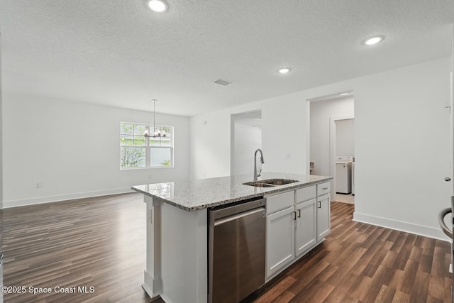 15 Ponderosa Ln, Palm Coast, FL 32164 - kitchen with stainless steel dishwasher, a sink, dark wood-type flooring, a chandelier, and a kitchen island with sink
