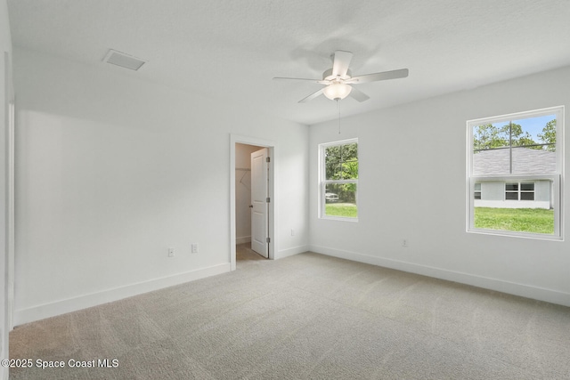 15 Ponderosa Ln, Palm Coast, FL 32164 - unfurnished room with light colored carpet, a ceiling fan, and baseboards