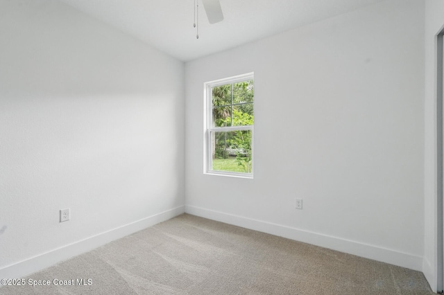 15 Ponderosa Ln, Palm Coast, FL 32164 - empty room featuring light colored carpet, a ceiling fan, and baseboards