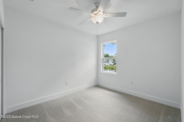 15 Ponderosa Ln, Palm Coast, FL 32164 - spare room featuring baseboards, carpet floors, and ceiling fan