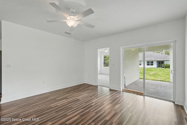 15 Ponderosa Ln, Palm Coast, FL 32164 - empty room with a ceiling fan, dark wood-style flooring, and baseboards