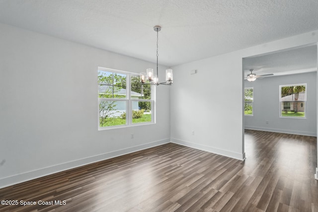 15 Ponderosa Ln, Palm Coast, FL 32164 - unfurnished room with a chandelier, plenty of natural light, and dark wood finished floors