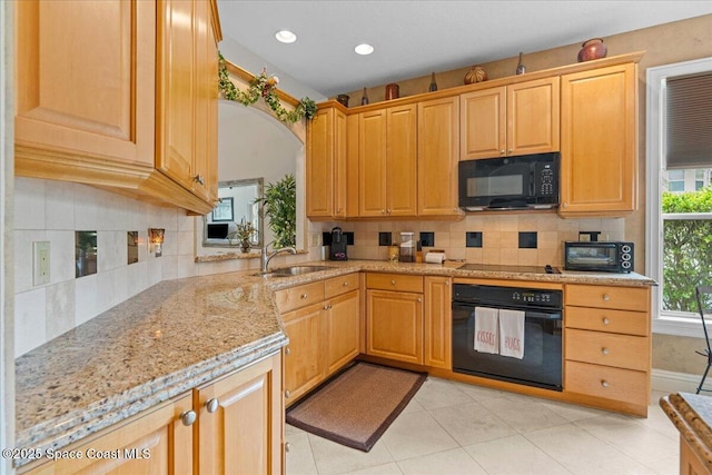 206 Islandia Ct Unit U-206, Satellite Beach, FL 32937 - kitchen with black appliances, a sink, backsplash, light stone counters, and recessed lighting