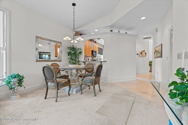 206 Islandia Ct Unit U-206, Satellite Beach, FL 32937 - dining room featuring vaulted ceiling, a chandelier, recessed lighting, baseboards, and light tile patterned floors