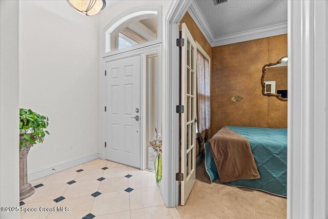 206 Islandia Ct Unit U-206, Satellite Beach, FL 32937 - foyer entrance featuring baseboards, crown molding, and a textured ceiling