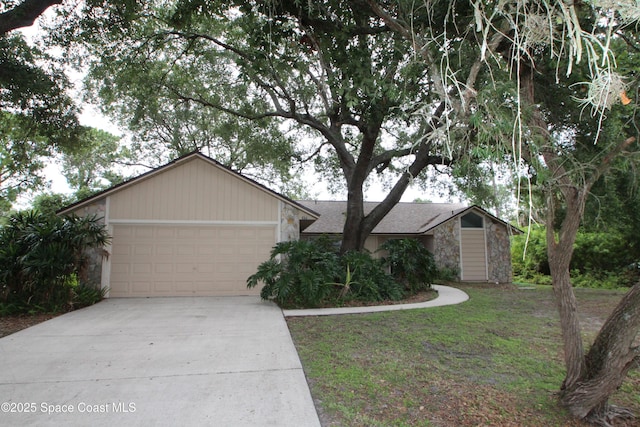 1361 Athens Dr NE, Palm Bay, FL 32907 - view of front of house with stone siding, an attached garage, and driveway