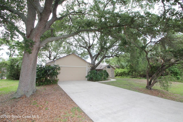 1361 Athens Dr NE, Palm Bay, FL 32907 - view of front of property featuring an attached garage, concrete driveway, and a front lawn