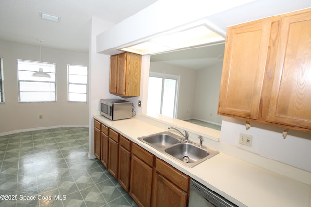 1361 Athens Dr NE, Palm Bay, FL 32907 - kitchen with a sink, appliances with stainless steel finishes, light countertops, and decorative light fixtures