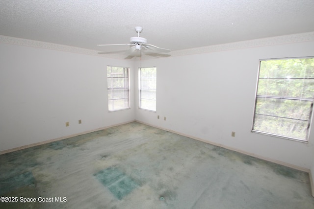 1361 Athens Dr NE, Palm Bay, FL 32907 - unfurnished room featuring carpet, ceiling fan, a textured ceiling, and baseboards