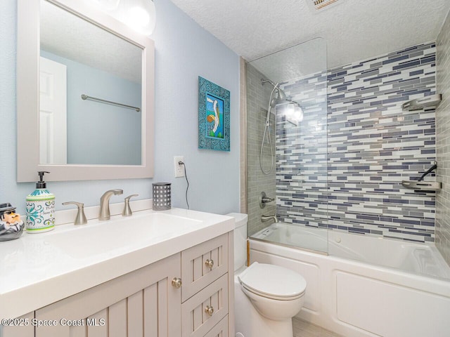 2815 S Atlantic Ave Unit 705, Cocoa Beach, FL 32931 - full bathroom featuring toilet, vanity, a textured ceiling, and bathing tub / shower combination