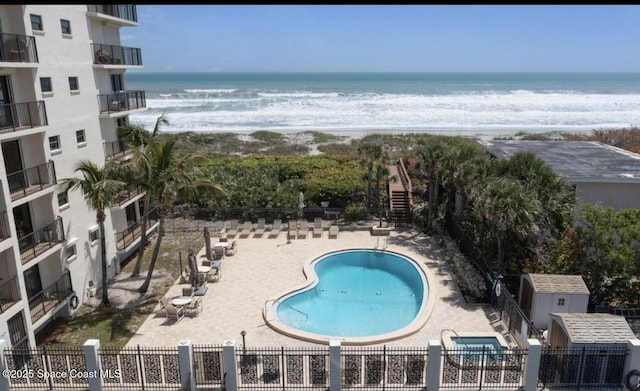 2815 S Atlantic Ave Unit 705, Cocoa Beach, FL 32931 - community pool featuring view of water and beach and a patio area