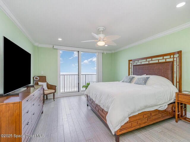 2815 S Atlantic Ave Unit 705, Cocoa Beach, FL 32931 - bedroom with access to outside, ornamental molding, recessed lighting, light wood-style flooring, and a ceiling fan