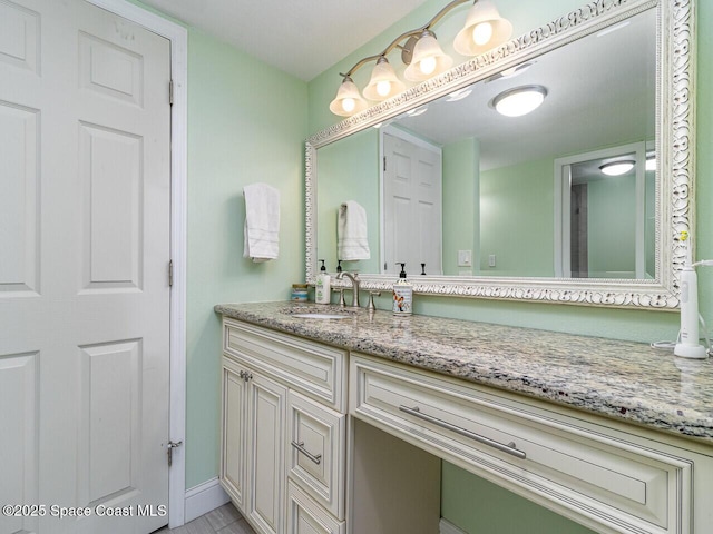 2815 S Atlantic Ave Unit 705, Cocoa Beach, FL 32931 - bathroom with vanity and baseboards