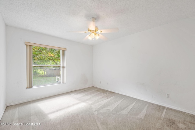 1527 Glencove Ave NW, Palm Bay, FL 32907 - carpeted spare room with ceiling fan, baseboards, and a textured ceiling