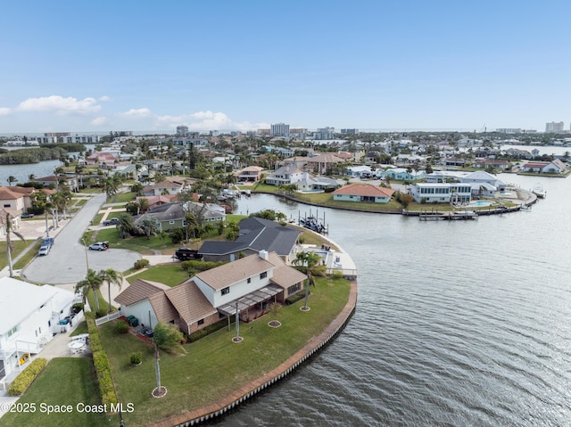284 Andros Ave, Cocoa Beach, FL 32931 - aerial perspective of suburban area featuring a large body of water