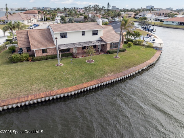 284 Andros Ave, Cocoa Beach, FL 32931 - aerial perspective of suburban area with a large body of water