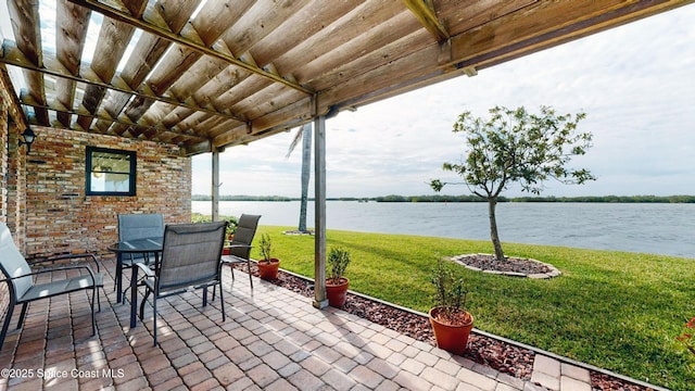 284 Andros Ave, Cocoa Beach, FL 32931 - view of patio / terrace featuring a water view and outdoor dining space