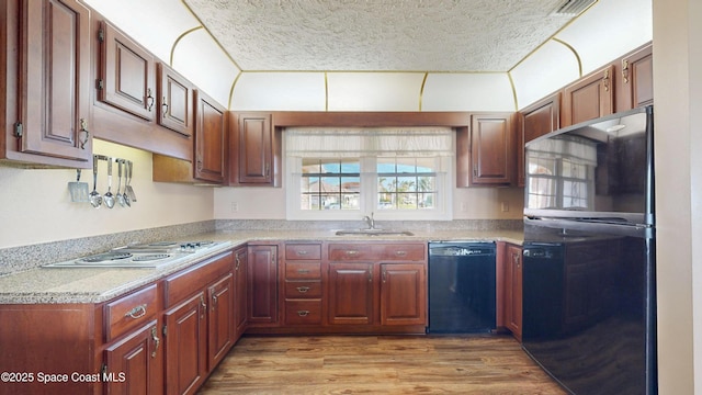 284 Andros Ave, Cocoa Beach, FL 32931 - kitchen with dishwashing machine, freestanding refrigerator, a sink, a textured ceiling, and light countertops