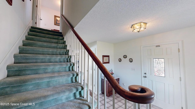 284 Andros Ave, Cocoa Beach, FL 32931 - stairs with a textured ceiling