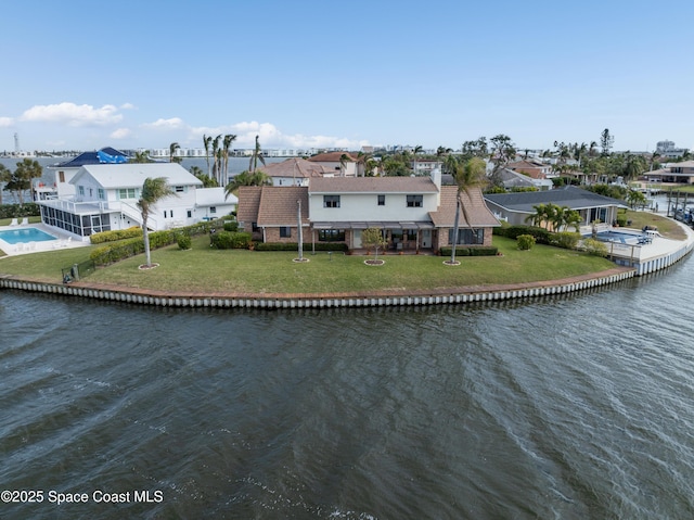 284 Andros Ave, Cocoa Beach, FL 32931 - aerial perspective of suburban area with a large body of water