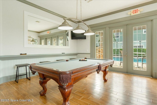 1475 Isabella Dr Unit 101, Melbourne, FL 32935 - rec room with french doors, ornamental molding, healthy amount of natural light, wood finished floors, and pool table