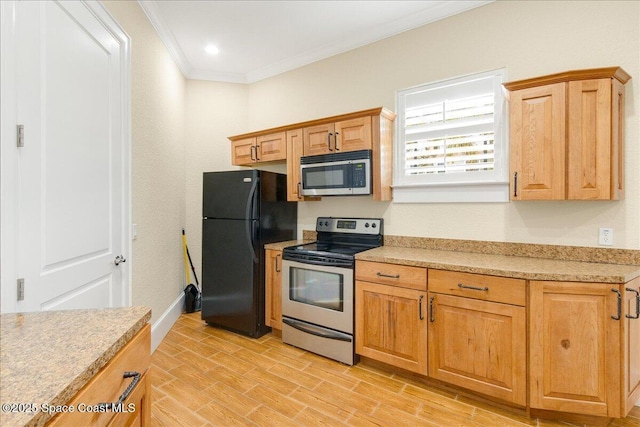 1475 Isabella Dr Unit 101, Melbourne, FL 32935 - kitchen with stainless steel appliances, ornamental molding, light countertops, and light wood-style flooring