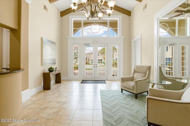 1475 Isabella Dr Unit 101, Melbourne, FL 32935 - foyer featuring high vaulted ceiling, a chandelier, french doors, beamed ceiling, and a ceiling fan