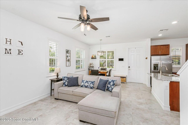 1475 Isabella Dr Unit 101, Melbourne, FL 32935 - living area with plenty of natural light, a ceiling fan, and recessed lighting