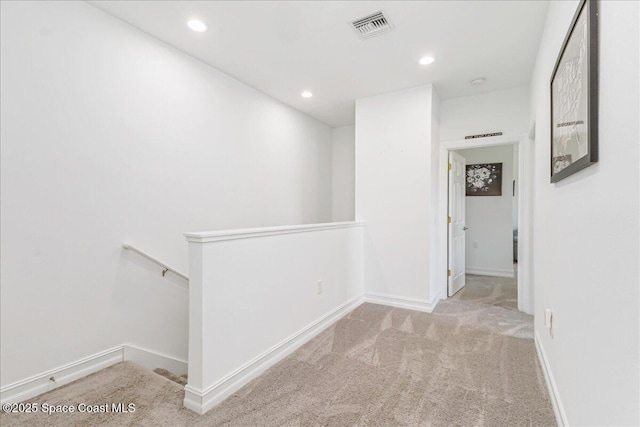 1475 Isabella Dr Unit 101, Melbourne, FL 32935 - hall featuring an upstairs landing, carpet flooring, and recessed lighting