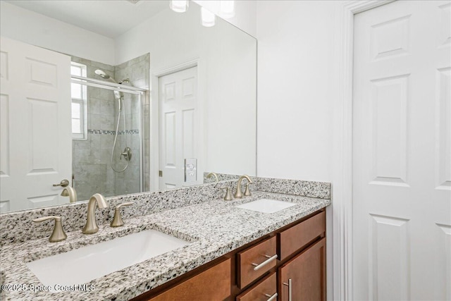 1475 Isabella Dr Unit 101, Melbourne, FL 32935 - bathroom with a stall shower and double vanity