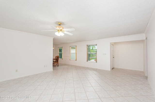 957 Waialae Cir NE, Palm Bay, FL 32905 - spare room with ceiling fan, ornamental molding, a textured ceiling, and light tile patterned floors