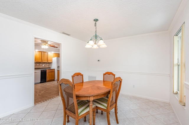 957 Waialae Cir NE, Palm Bay, FL 32905 - dining space with a chandelier, light tile patterned floors, crown molding, and a textured ceiling