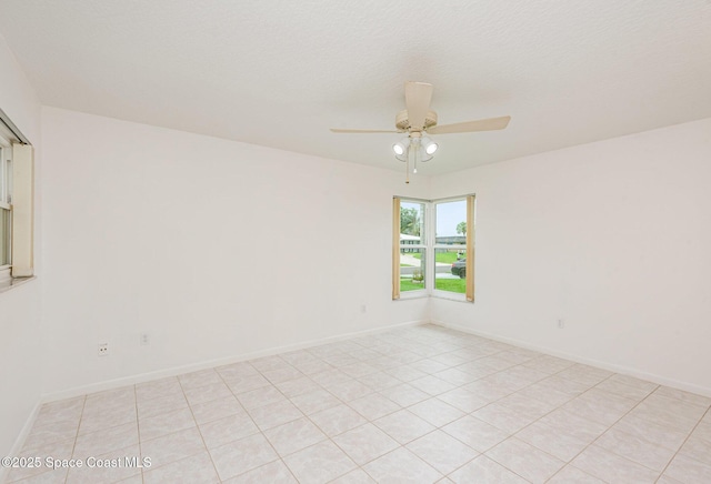 957 Waialae Cir NE, Palm Bay, FL 32905 - spare room featuring ceiling fan, light tile patterned floors, and baseboards