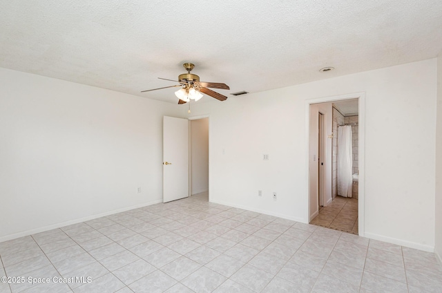 957 Waialae Cir NE, Palm Bay, FL 32905 - unfurnished room featuring a ceiling fan, light tile patterned floors, and a textured ceiling