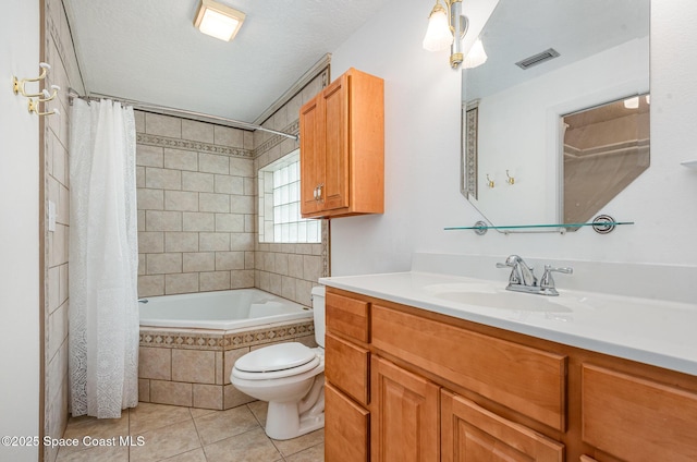 957 Waialae Cir NE, Palm Bay, FL 32905 - full bathroom featuring tile patterned flooring, toilet, vanity, and tiled shower / bath
