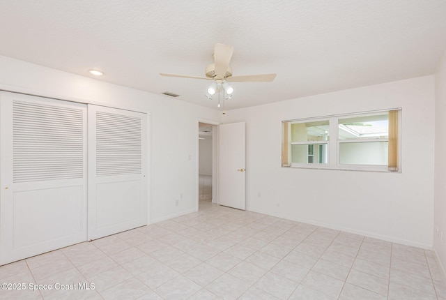 957 Waialae Cir NE, Palm Bay, FL 32905 - unfurnished bedroom featuring a closet, recessed lighting, a ceiling fan, and baseboards