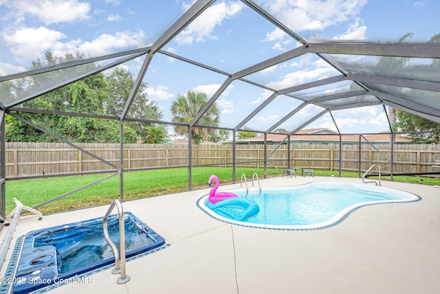 957 Waialae Cir NE, Palm Bay, FL 32905 - view of pool with an outdoor hot tub, a patio, and glass enclosure