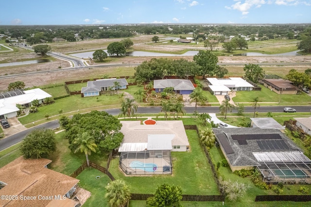 957 Waialae Cir NE, Palm Bay, FL 32905 - aerial perspective of suburban area with a nearby body of water and a pool area