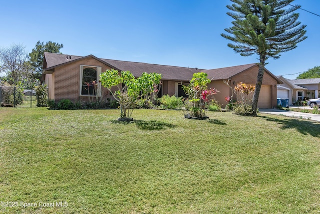 1262 Heberling St NW, Palm Bay, FL 32907 - view of front facade with a garage, brick siding, and driveway