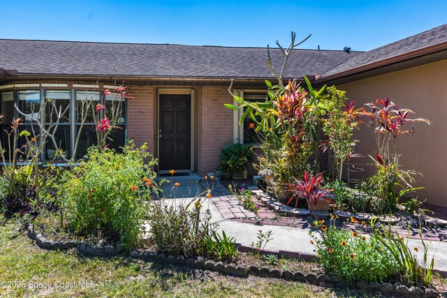 1262 Heberling St NW, Palm Bay, FL 32907 - doorway to property with brick siding and roof with shingles